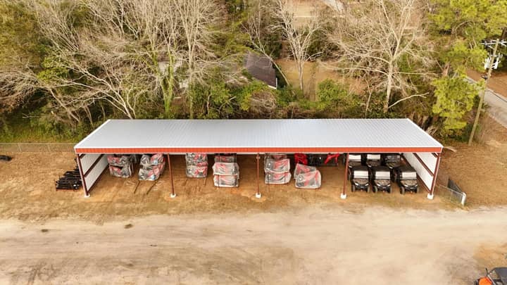 Aerial view of an open storage shed loaded with pallets