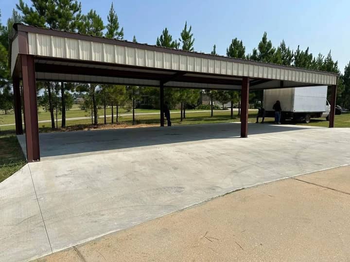 Brown steel frame carport pavilion on a new concrete slab