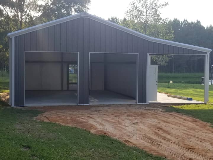Gray metal two-car garage with carport extension