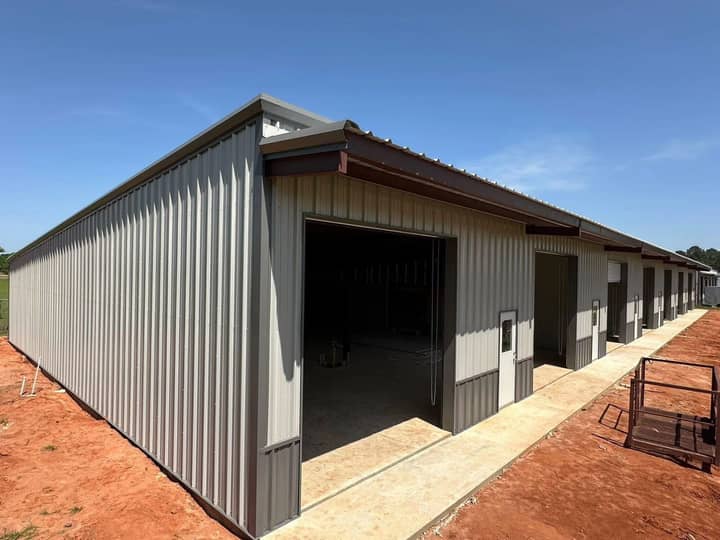 Long tan metal building with multiple entry doors