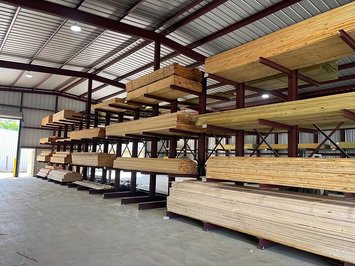 Inside a clear-span steel lumber warehouse with cantilever racks