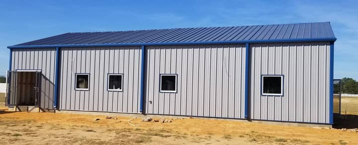 Metal office building with blue trim and windows