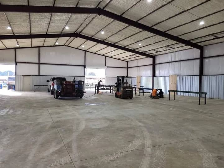 Inside a clear-span metal warehouse with LED high-bay lighting